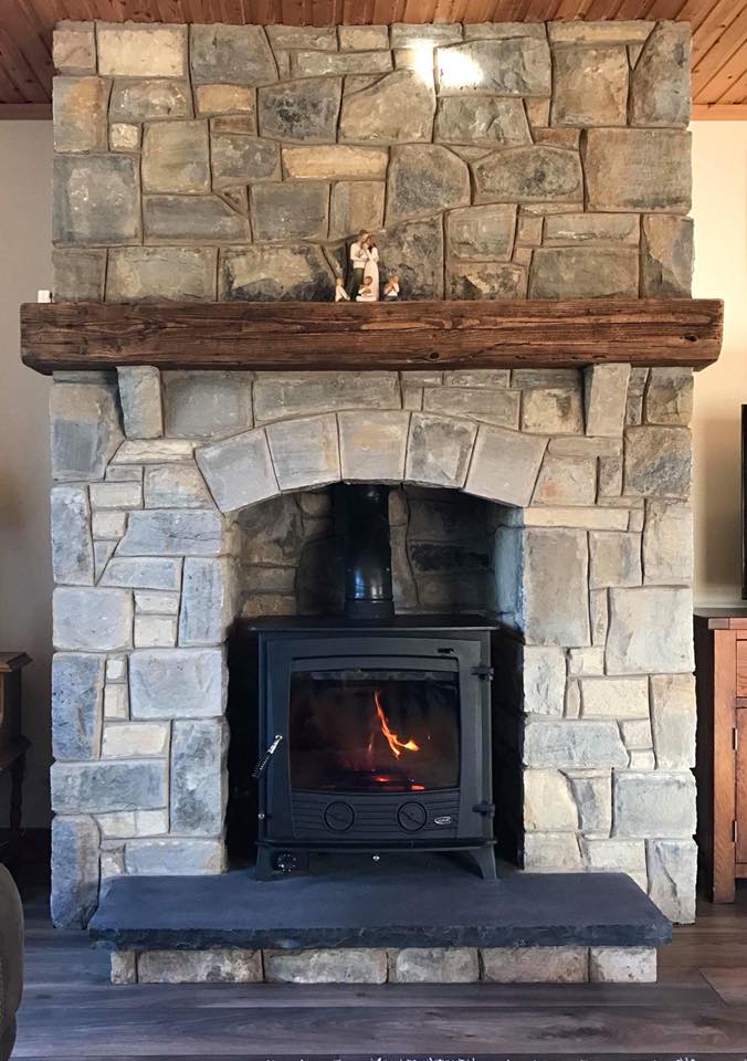 Blue Centred Sandstone Fireplace built by Stone Solutions Northern Ireland
